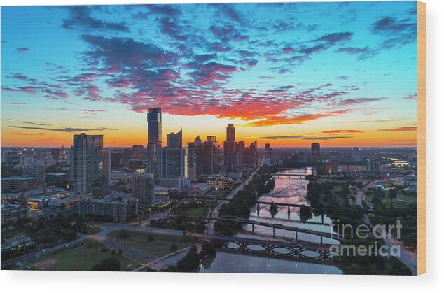 Austin Skyline Wood Print featuring the photograph Aerial image of the Austin Skyline and Lady Bird Lake during a b by Dan Herron