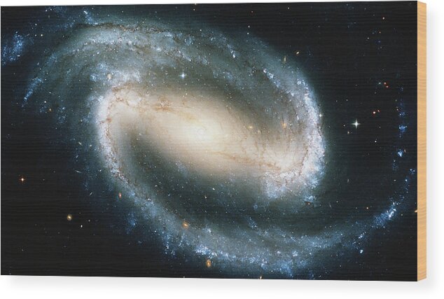 Spiral Galaxy Wood Print featuring the photograph Barred Spiral Galaxy Ngc 1300 by Stocktrek