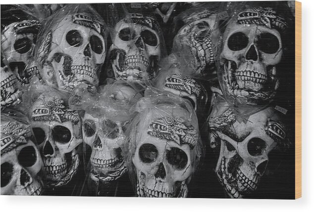 Barberville Roadside Yard Art And Produce Wood Print featuring the photograph Macabre Plastic Skulls by Tom Singleton