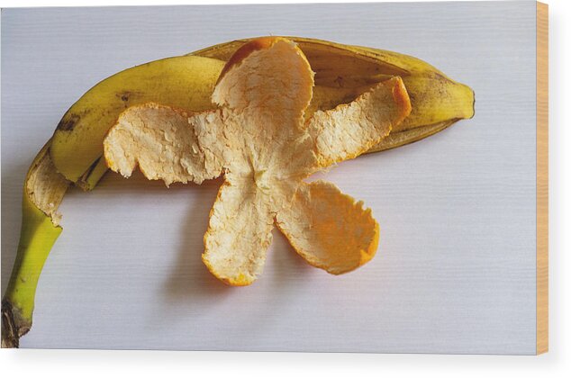 Orange Wood Print featuring the photograph Orange on Banana by Ivars Vilums