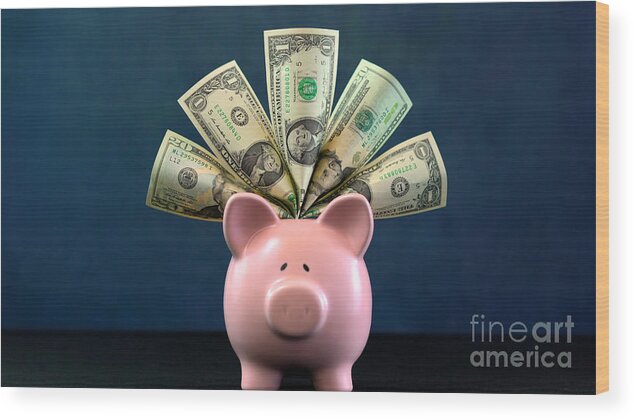 401k Wood Print featuring the photograph Pink Piggy bank money concept on dark blue background #1 by Milleflore Images