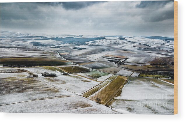 Above Wood Print featuring the photograph Aerial View Of Winter Landscape With Remote Settlements And Snow Covered Fields In Austria by Andreas Berthold
