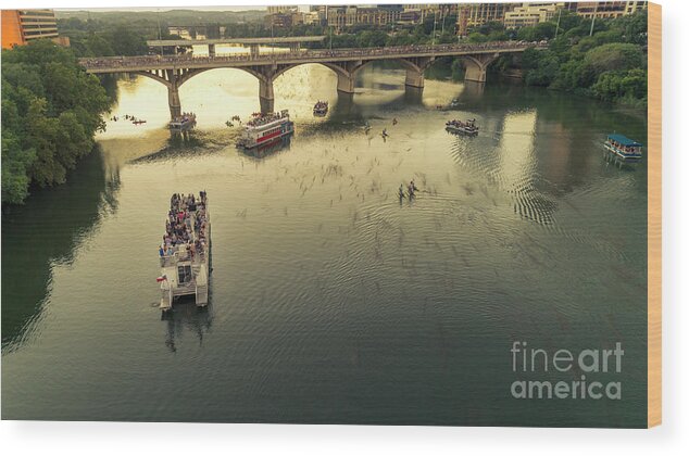Bat Viewing Wood Print featuring the photograph Bat watchers stand in tour boats as the bats take flight during sunset on the Congress Avenue Bridge over Lady Bird Lake in downtown Austin, Texas by Dan Herron