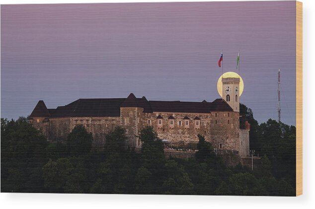 Ljubljana Wood Print featuring the photograph Full moon behind Ljubljana Castle by Ian Middleton
