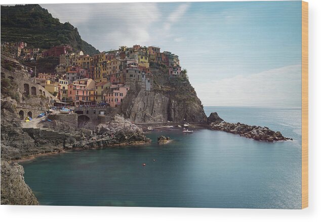 Cinque Terre Wood Print featuring the photograph Village of Manarola with colourful houses at the edge of the cliff Riomaggiore, Cinque Terre, Liguria, Italy by Michalakis Ppalis