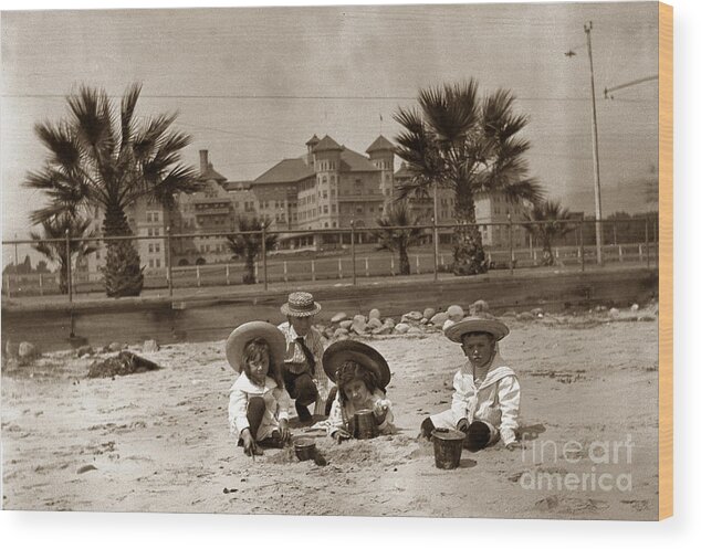 Children Wood Print featuring the photograph Children on the Santa Barbara beach in front of the Potter Hotel circa 1915 by Monterey County Historical Society