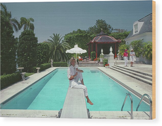 1980-1989 Wood Print featuring the photograph Pool And Parasol by Slim Aarons