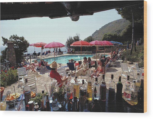1980-1989 Wood Print featuring the photograph Poolside Bar by Slim Aarons