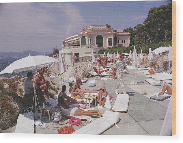 People Wood Print featuring the photograph Sunbathing At Hotel Du Cap-eden-roc by Slim Aarons