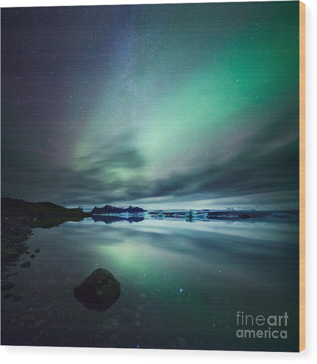 Aurora Wood Print featuring the photograph Aurora borealis Northern lights over glacial lagoon in Iceland #3 by Matteo Colombo
