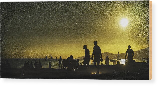 Back Lit Wood Print featuring the photograph Sunset silhouette of people at the beach by Peter V Quenter