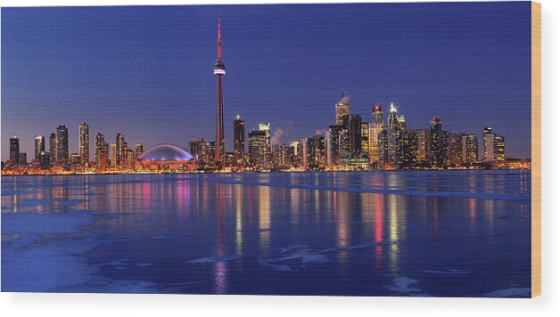 Frozen Wood Print featuring the photograph Panorama of frozen ice covered Lake Ontario reflecting the light by Reimar Gaertner