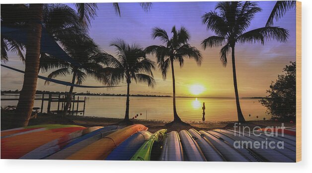 Florida Sunset Wood Print featuring the photograph Sunset over the Kayaks by Jon Neidert