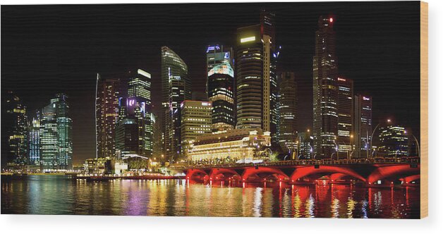 Panoramic Wood Print featuring the photograph Singapore Skyline By Night by Marc Rauw