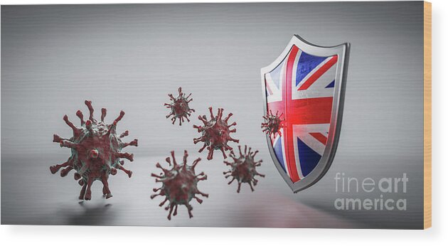 Shield Wood Print featuring the photograph Shield in UK flag protect from coronavirus COVID-19. by Michal Bednarek