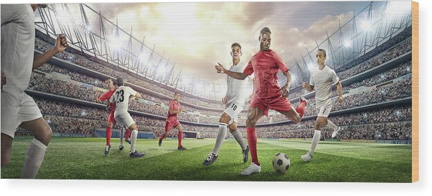 Soccer Uniform Wood Print featuring the photograph Soccer Player Kicking Ball In Stadium #3 by Dmytro Aksonov
