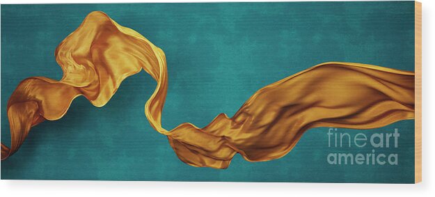 Yellow Wood Print featuring the photograph Yellow silk fabric floating in front of blue background wall. Fl by Jelena Jovanovic