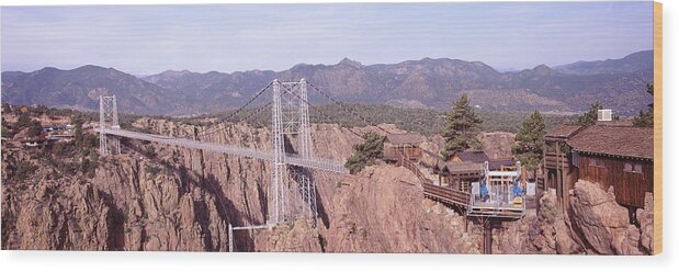 Photography Wood Print featuring the photograph Suspension Bridge Across A Canyon by Panoramic Images