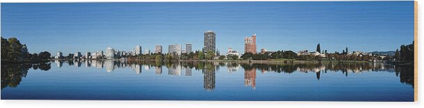 Photography Wood Print featuring the photograph Skyline Of Oakland And Lake Merritt by Panoramic Images