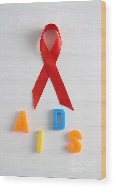 Acquired Immune Deficiency Wood Print featuring the photograph Aids Awareness Symbol #1 by Photo Researchers, Inc.