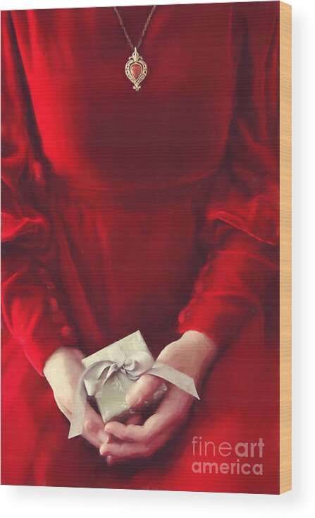 Atmosphere Wood Print featuring the photograph Woman in red dress holding gift/ digital painting by Sandra Cunningham