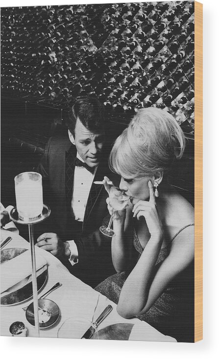 Architecture Wood Print featuring the photograph A Glamorous 1960s Couple Dining by Horn & Griner