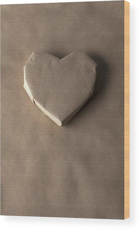 Shadow Wood Print featuring the photograph A Heart Shaped Object Wrapped In Brown by Larry Washburn