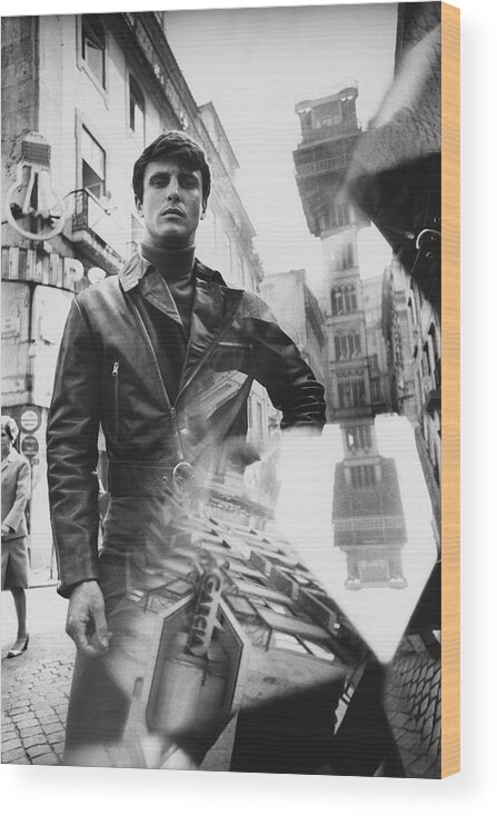 Architecture Wood Print featuring the photograph A Male Model Posing In Front Of The Elevator De by Leonard Nones