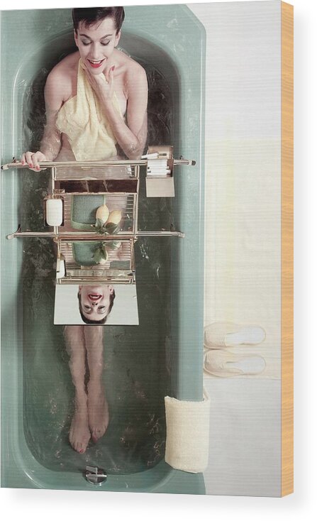 Bathroom Wood Print featuring the photograph A Model In A Bathtub by Herbert Matter