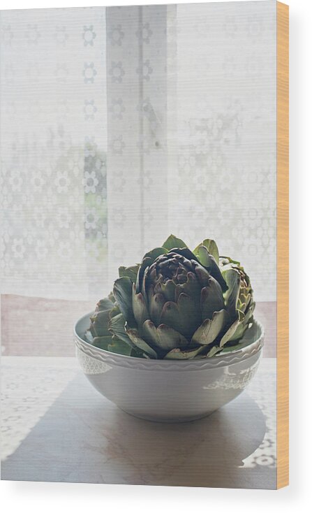 Home Interior Wood Print featuring the photograph Artichoke In A Bowl On Sunlit Windowsill by Kathleen Finlay