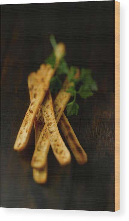 Baked Pastry Item Wood Print featuring the photograph Breadsticks On Wooden Table, Close Up by Westend61