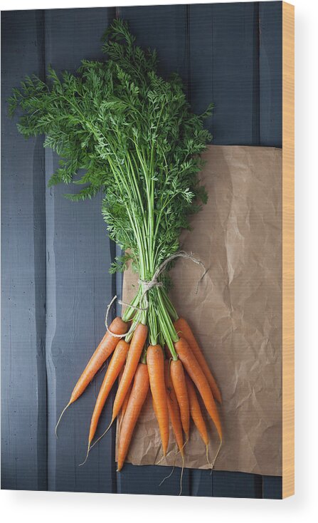 Bunch Wood Print featuring the photograph Carrots With Brown Paper On Wooden by Westend61