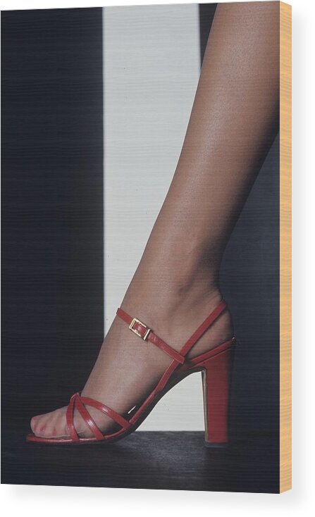 Fashion Wood Print featuring the photograph Foot Of A Model Wearing A Red Sandal by Bob Stone