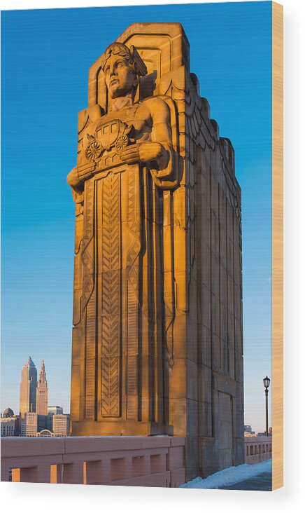 Guardians Of Transportation Wood Print featuring the photograph Guardian Towering Over Cleveland by Clint Buhler