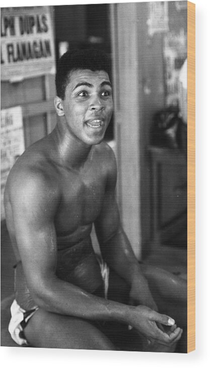 Marvin Newman Wood Print featuring the photograph Muhammad Ali Sitting And Talking by Retro Images Archive