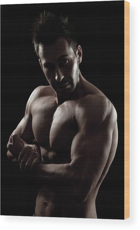 Human Arm Wood Print featuring the photograph Muscular Young Bodybuilder by Leopatrizi