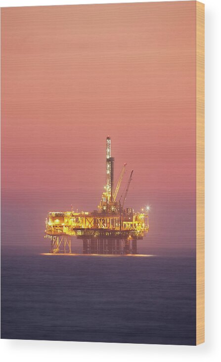 Orange Color Wood Print featuring the photograph Oil Rig Platform In Twilight by Jimkruger