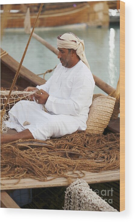 Doha Wood Print featuring the photograph Omani net-making demonstration by Paul Cowan