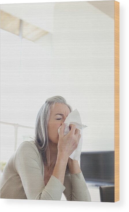 Cold And Flu Wood Print featuring the photograph Sick woman blowing her nose by Sam Edwards