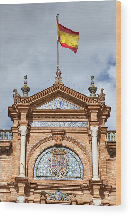 Spanish Wood Print featuring the photograph Spanish Flag and Crest on Plaza de Espana Pavilion in Seville by Artur Bogacki
