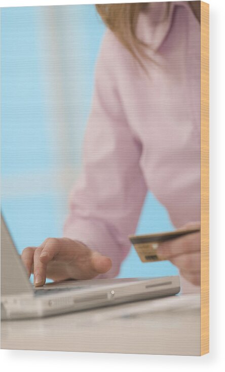 People Wood Print featuring the photograph Woman with laptop and credit card by Comstock Images
