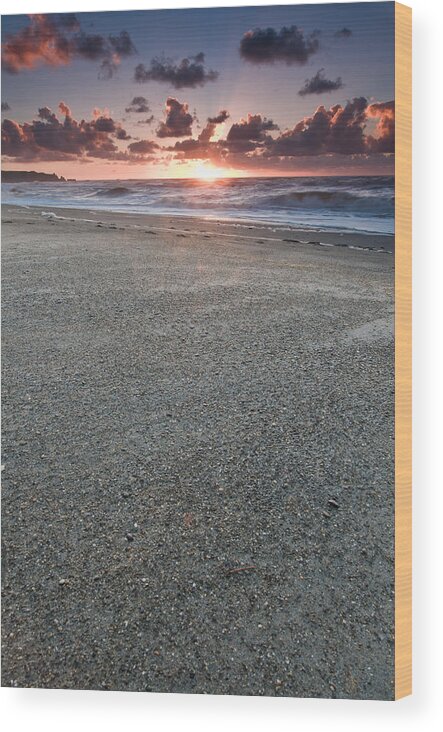 Beach Wood Print featuring the photograph A beach during sunset with glowing sky by U Schade