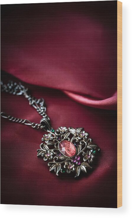 Brass Wood Print featuring the photograph Brass pendant with red gem by Jaroslaw Blaminsky