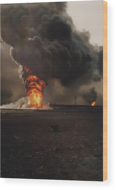 Aftermath Wood Print featuring the photograph Burning oil well fires in field with oil slick, Kuwait by Karen Foley