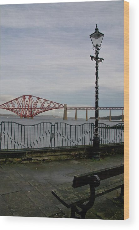 Forth Rail Bridge Wood Print featuring the photograph View at the Forth rail bridge from High Street in South Queensferry by Elena Perelman