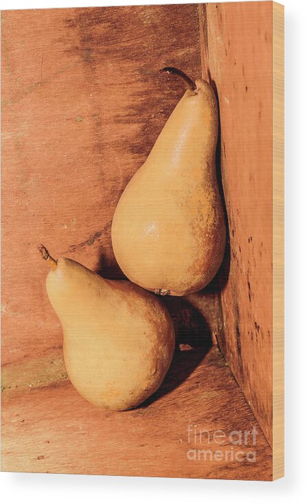 Pear Wood Print featuring the photograph Yellow colored pears on wooden background by Jorgo Photography