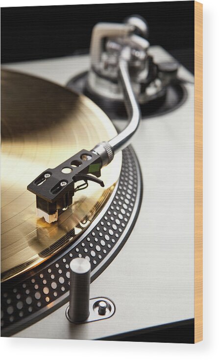 Music Wood Print featuring the photograph A Gold Record On A Turntable by Caspar Benson