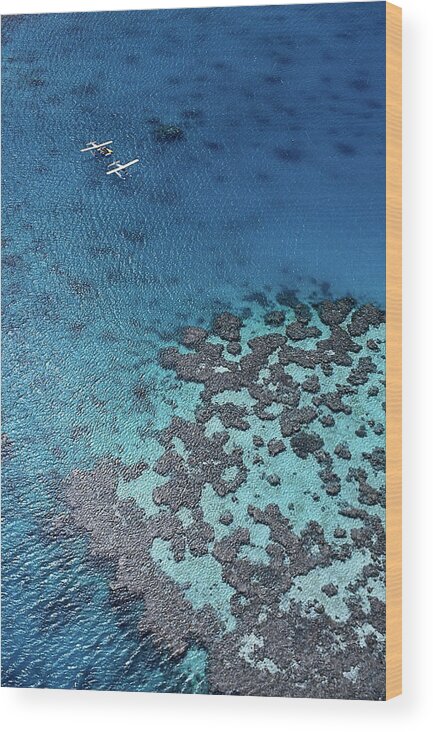 Two Objects Wood Print featuring the photograph Aerial View Of Seaplanes Landed Near by John Banagan