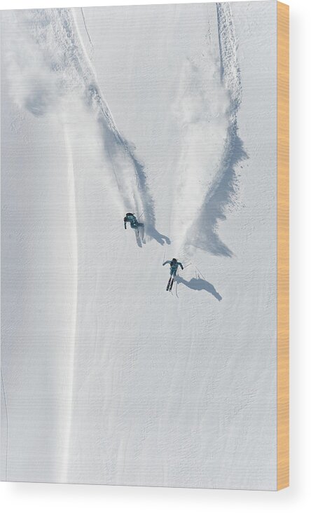 Crash Helmet Wood Print featuring the photograph Aerial View Of Two Skiers Skiing by Creativaimage