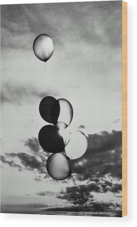 Mid-air Wood Print featuring the photograph Bunch Of Balloons In Sky, One Floating by Ross Anania